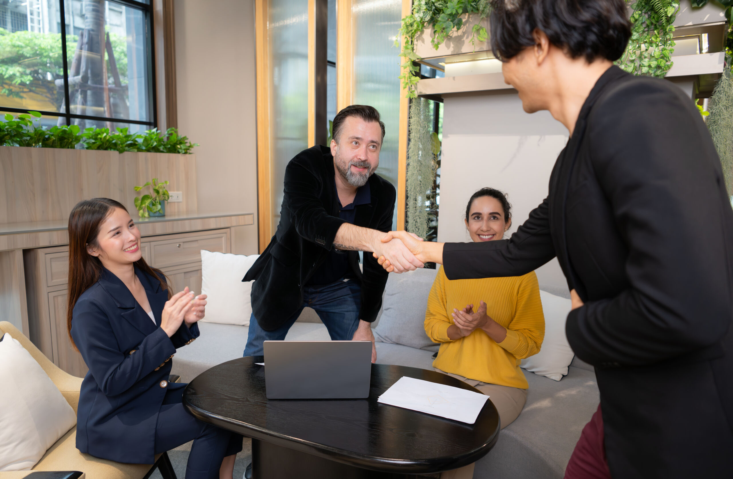 Businessman and businesswoman discussing a project in the meeting room of co-working space